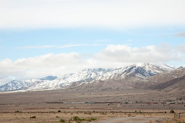 istock Manzano Mountain with Snow and Freight Train 185231686