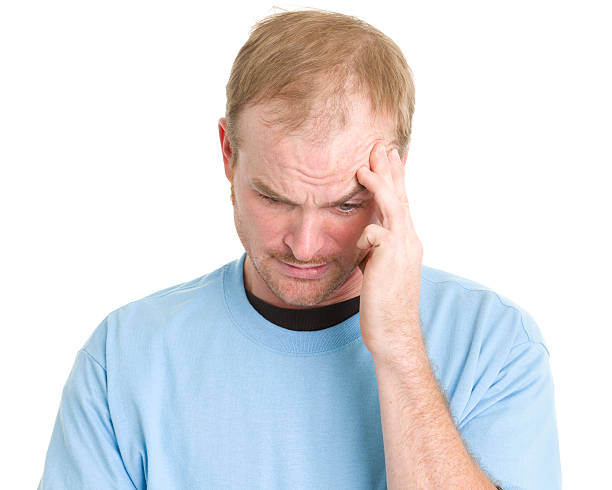 istock Worried Man Rubbing Temple 185231689
