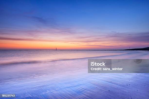 Beach At Dusk In Zeeland The Netherlands Stock Photo - Download Image Now - Beach, Blurred Motion, Breaking Wave