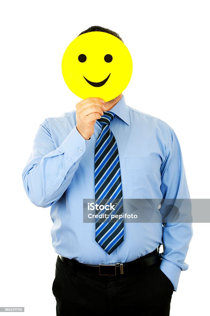 Empresário com sorriso máscara - Foto de stock de Rosto humano sorridente royalty-free