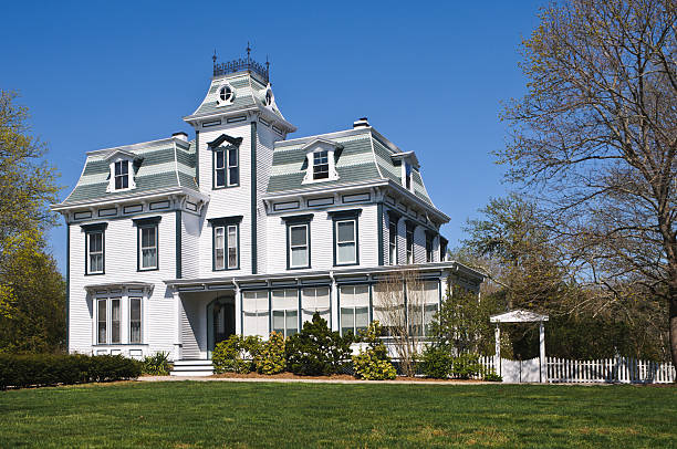 Classic Second Empire Style Home "With its mansard roof, dormers and large first and second floor windows this well restored Second Empire Victorian Home (1874) in southeastern Massachusetts shows pride of ownership" victorian houses exterior stock pictures, royalty-free photos & images