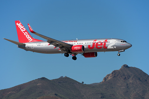 Tenerife, Spain December 9st, 2023. Boeing 737-8MG Jet2 Airlines flies in the blue sky. Landing at Tenerife Airport