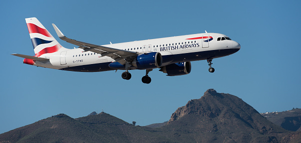 Tenerife, Spain December 9st, 2023. Airbus A320-251N British Airways Airlines flies in the blue sky. Landing at Tenerife Airport