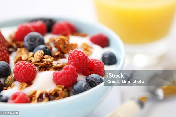 Yogurt With Fresh Berries And Granola Served In A White Bowl Stock Photo - Download Image Now