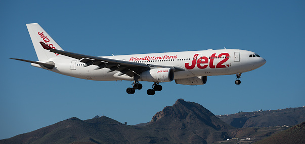 Tenerife, Spain December 9st, 2023. Airbus A330-243 Jet2 Airlines flies in the blue sky. Landing at Tenerife Airport
