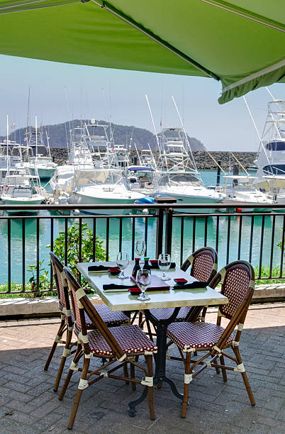 istock Table at outdoor restaurant next to marina 185232380