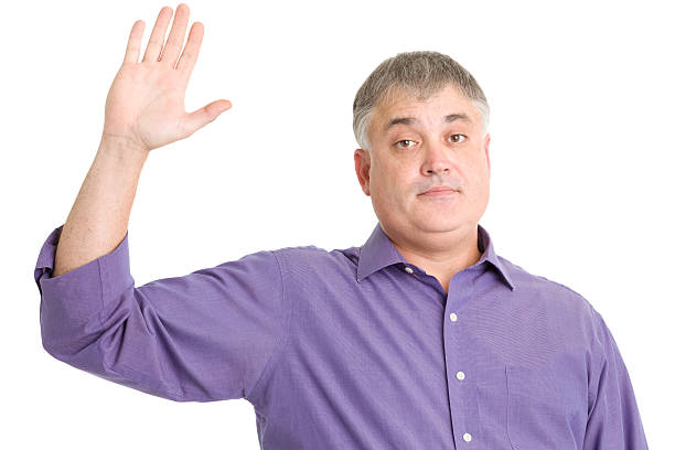 istock Mature Man Raises Hand 185232538