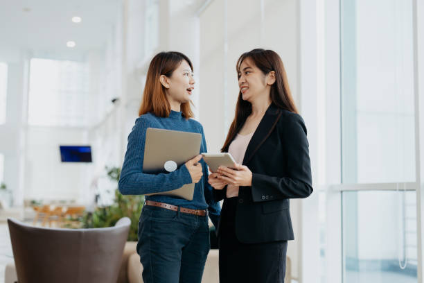 istock Asian businesswomen talking in office 1852325982