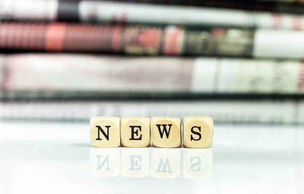 istock NEWS - newspapers in the background 185232824