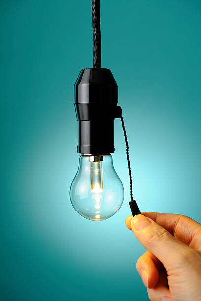 istock Turn the LED light bulb on or off with finger 185232841