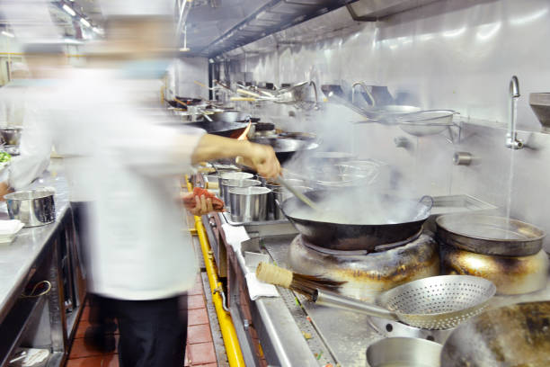 istock Chinese chefs busy stirfrying in the restaurant kitchen. 1852328616