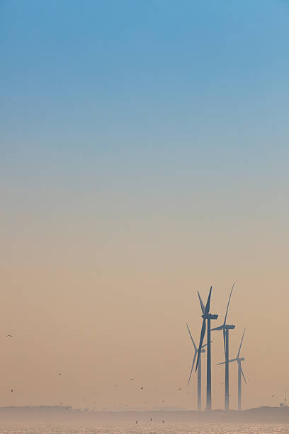 istock wind turbine power stations against a blue sky 185233009