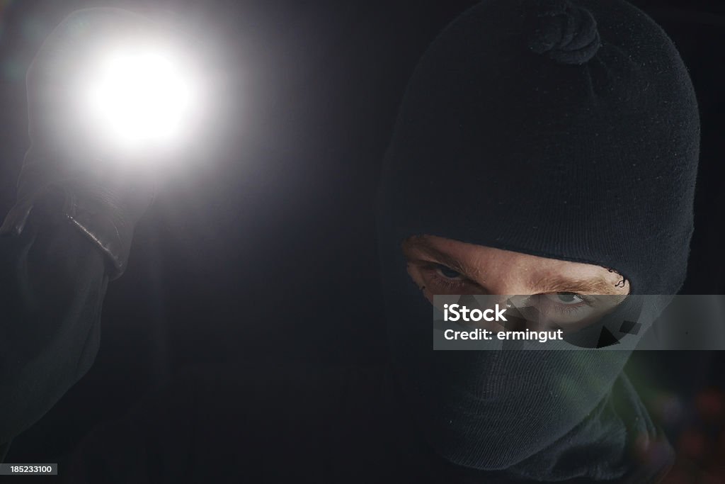 Masken Dieb mit Taschenlampe - Lizenzfrei Einbrecher Stock-Foto