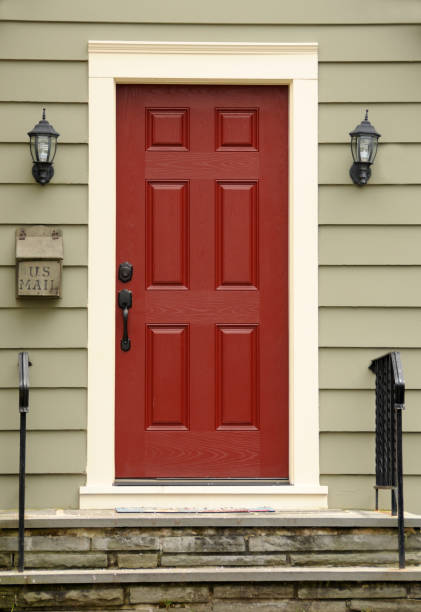 Red Door Red wooden door on Colonial home.  FOR MORE HOUSES AND DOORS (CLICKHERE) front door stock pictures, royalty-free photos & images