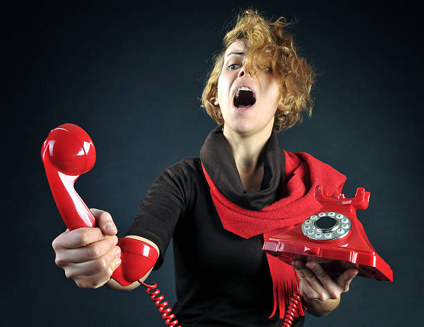 istock Young Woman shouting into telephone 185233731
