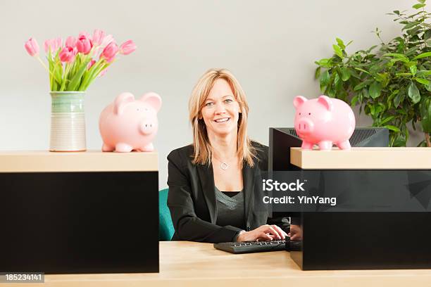 Friendly Woman Banker Working In Retail Banking Teller Window Hz Stock Photo - Download Image Now