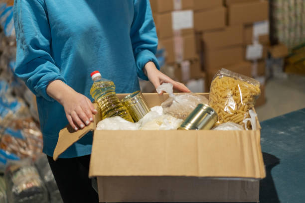 istock Volunteer girl preparing donation boxes 1852342022