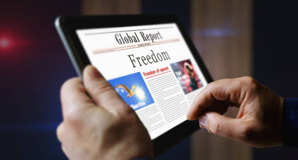 istock Freedom newspaper on mobile tablet screen 1852342567