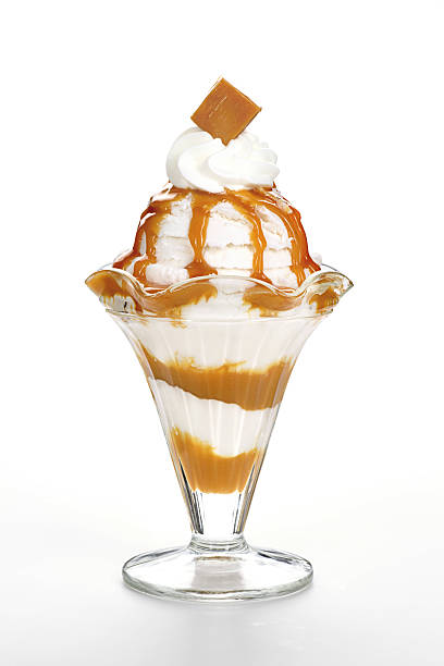 Caramel Sundae Classic caramel or butterscotch caramel sundae on white. parfait stock pictures, royalty-free photos & images