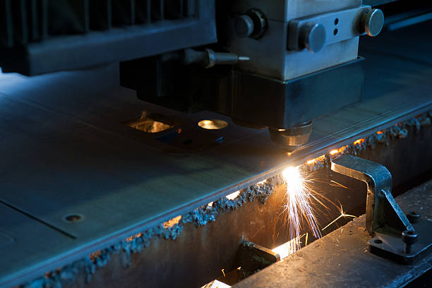 istock Numerical control machine with laser beam cutting metal sheet, detail 185234604