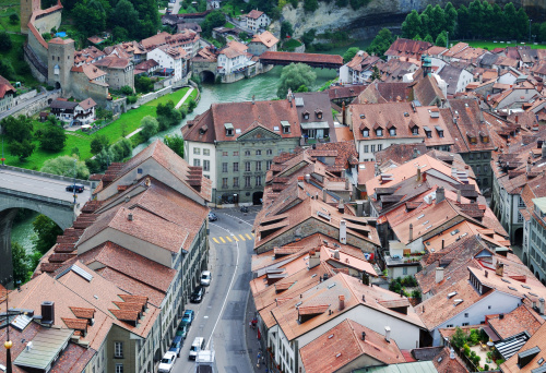 Fribourg is located on both sides of the river Sarine on the Swiss plateau. Its old city sits on a small rocky hill above the valley of the Sarine. The hill is flanked by steep wooded slopes.