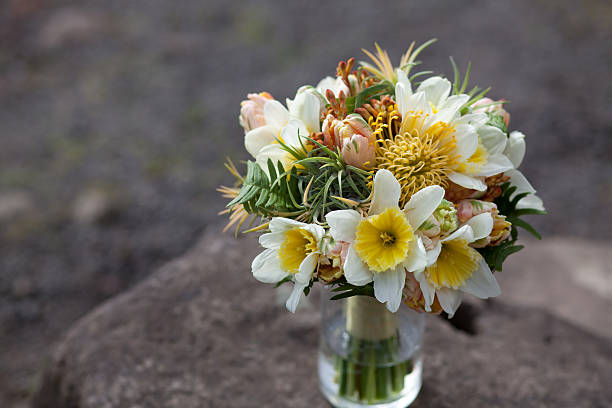 Yellow, green and peach wedding floral bouquet stock photo