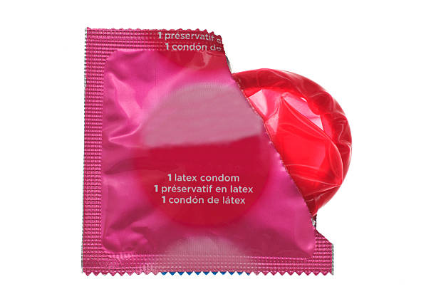 Condom half out of package stock photo