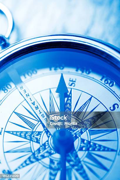 Compass On Blue Stock Photo - Download Image Now - Antique, Arrow - Bow and Arrow, Blue