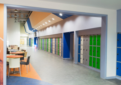 Interior area with seating and lockers near the entrance of a modern secondary school.
