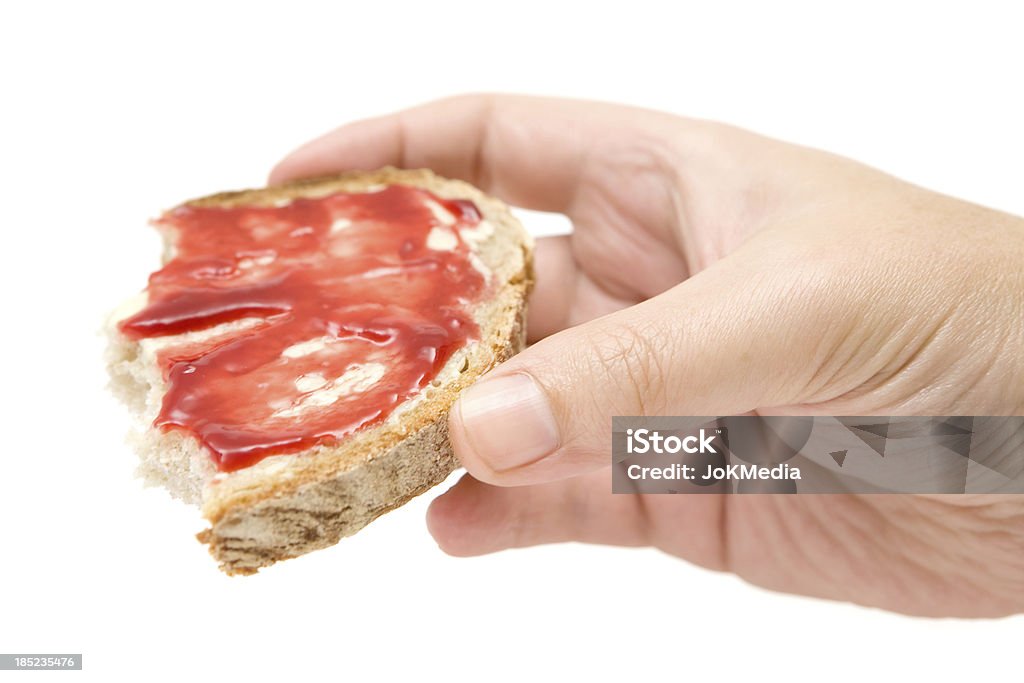 Mangia pane con Burro e marmellata - Foto stock royalty-free di Pane a fette