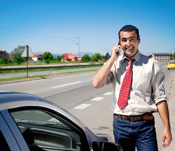 istock Businessman on the phone next to car 185236664