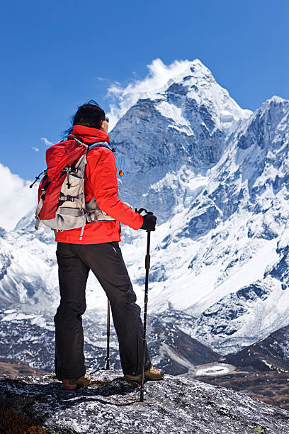 istock Woman looking at Ama Dablam, Mount Everest National Park 185236809