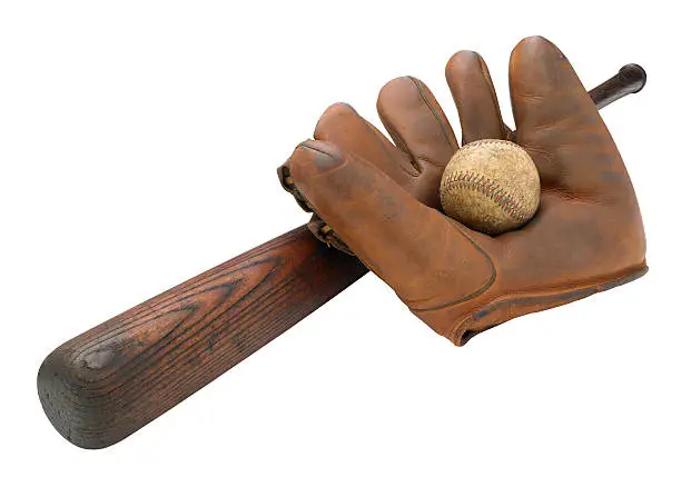 Horizontal photo of an antique baseball glove, bat and baseball isolated on a white background with a clipping path.