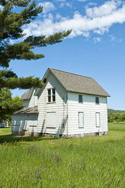 istock Abandoned Farm House in Sunny Summer Meadow 185238428