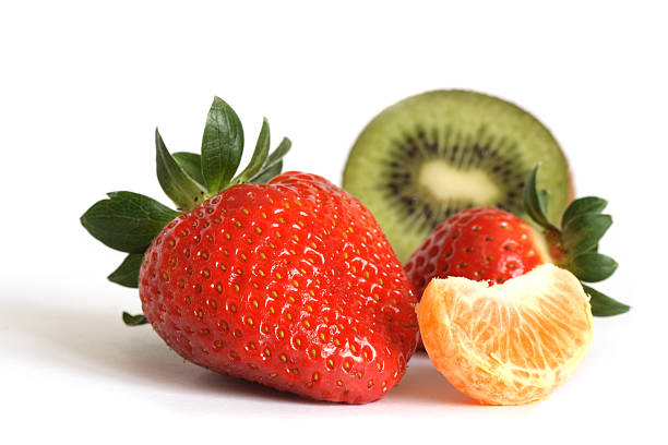 istock strawberries, tangerines, kiwi fruit  on a white background 185238435