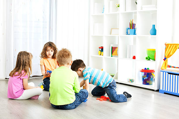 istock Preschool: Children Having Activities with Blocks Puzzle. 185238561