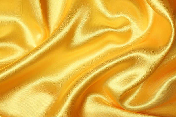 Yellow Silk Texture Yellow color silk texture background. mustard yellow fabric stock pictures, royalty-free photos & images