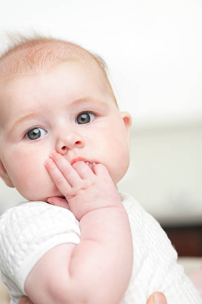 istock Baby sucking her fingers 185238986