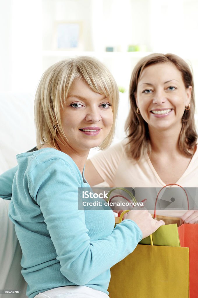 shopping happy young women with shopping bags Adult Stock Photo