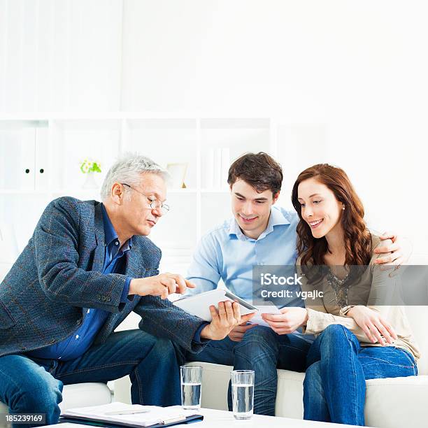 Couple Meeting With Financial Advisor Stock Photo - Download Image Now - Banking, Lawyer, People