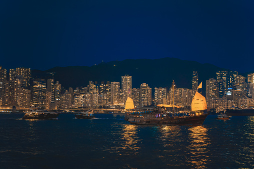 Hong Kong cityscape with junkboat skyline at night