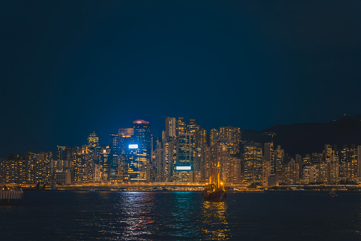 Hong Kong cityscape with junkboat skyline at night