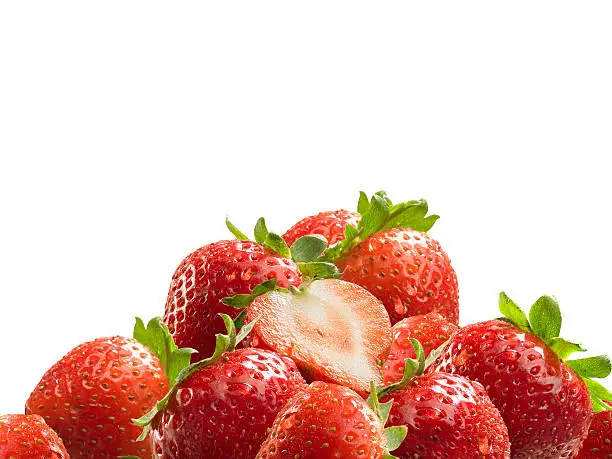 A heap of fresh strawberries with dew on white background.
