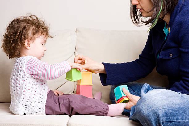 istock Mother playing with her baby 185239577