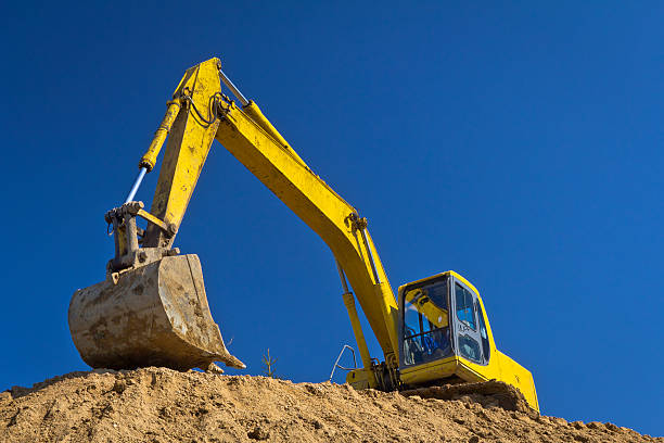 istock Yellow Excavator against blue sky 185239996