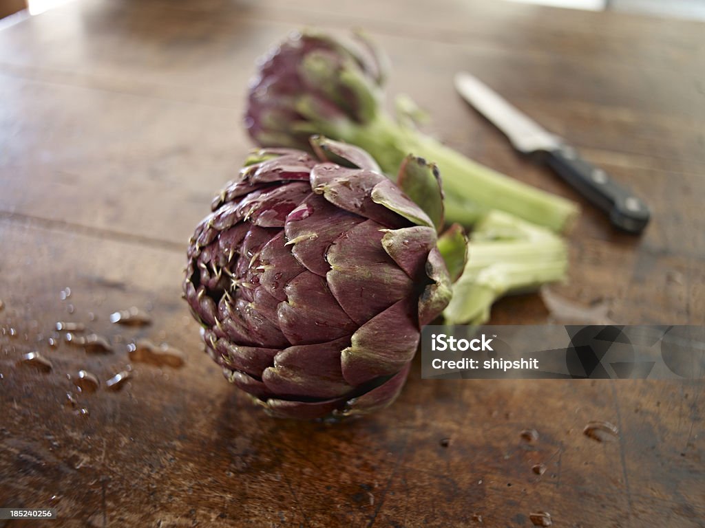 Artichokes Artichokes on an old wooden table. Shallow depth of field.Need more images of artichokes Armed Forces Rank Stock Photo