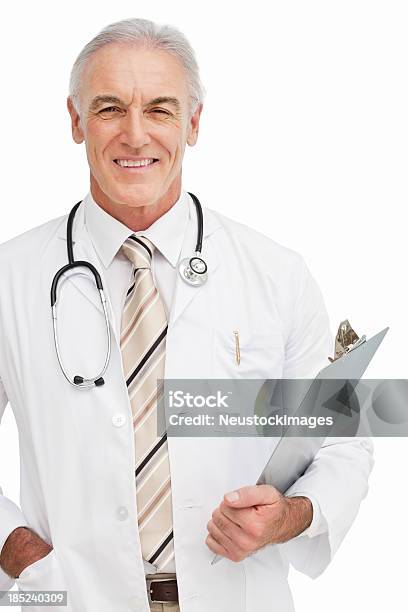 Smiling Doctor With Clip Board Isolated Stock Photo - Download Image Now - 50-59 Years, Adult, Adults Only