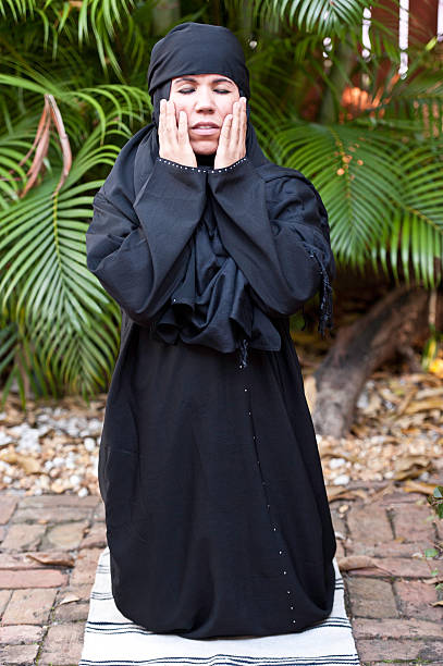istock Muslim women praying to Allah. 185240365