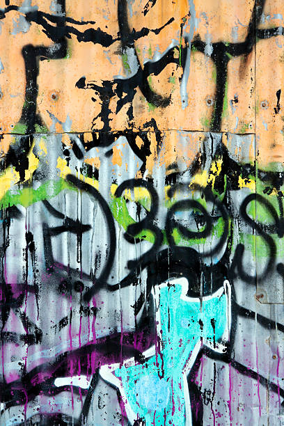 istock Colourful graffiti on weathered corrugated iron fence 185240478