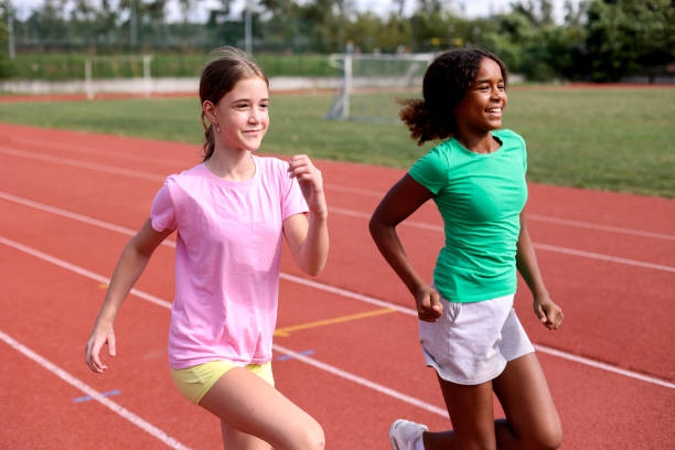 istock Girls running on a track 1852405639